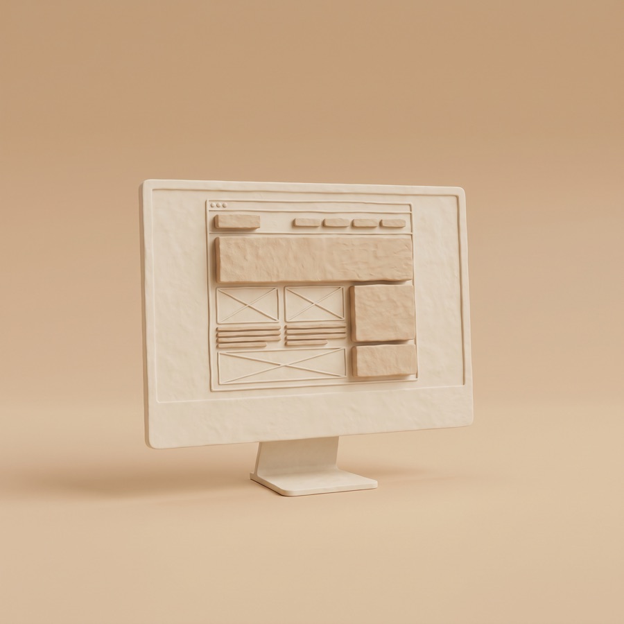 A monitor showing a website being built